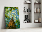 swirling sky through a treetop canopy panel resting in a shelving niche in a modern interior