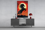 a rearing black horse under a red moon glass wall art styled in an atmospheric room setting