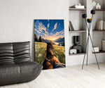 a first-person horseback ride toward a valley glass wall art leaning beside a dark leather sofa