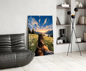 a first-person horseback ride toward a valley glass wall art leaning beside a dark leather sofa