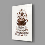 a latte-art coffee cup with hand lettering glass wall art angled to show the polished tempered glass panel