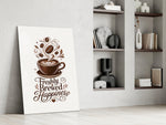 a latte-art coffee cup with hand lettering panel resting in a shelving niche in a modern interior