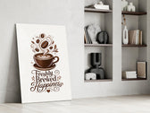 a latte-art coffee cup with hand lettering panel resting in a shelving niche in a modern interior