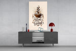 a coffee cup with a sunburst and lettering glass wall art styled in an atmospheric room setting