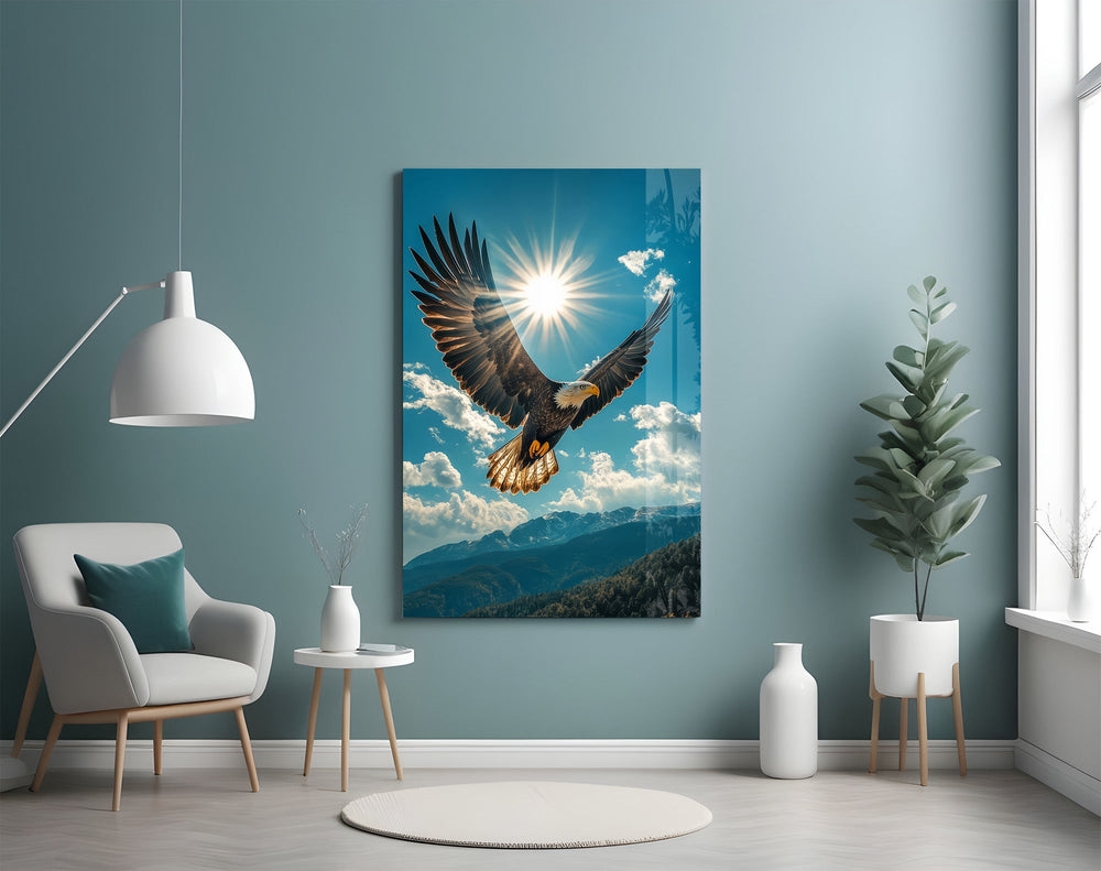 a bald eagle before a bright sunburst glass wall art styled above an armchair in a reading corner