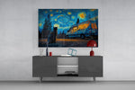 a cat watching a camper van under a swirling starry sky glass wall art styled in an atmospheric room setting