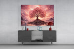 a pink cherry blossom tree at sunset glass wall art styled in an atmospheric room setting