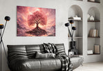 a pink cherry blossom tree at sunset glass wall art styled above an armchair in a reading corner