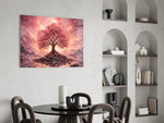 a pink cherry blossom tree at sunset glass wall art leaning beside a dark leather sofa