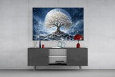 a white blossom tree beneath a full moon glass wall art styled in an atmospheric room setting