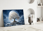 a white blossom tree beneath a full moon panel bringing character to a minimalist living room wall