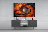 an autumn forest spiralling into a tunnel of light glass wall art styled in an atmospheric room setting