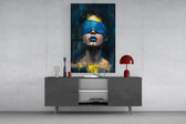 a blindfolded woman with blue lips and dripping paint glass wall art styled in an atmospheric room setting