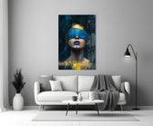 a blindfolded woman with blue lips and dripping paint panel bringing character to a minimalist living room wall
