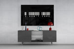 I dont care barcode statement glass wall art styled in an atmospheric room setting