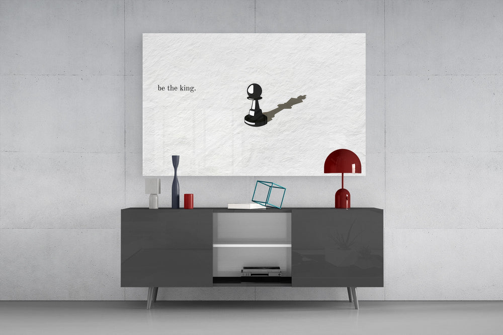 chess pawn casting a king shadow glass wall art styled in an atmospheric room setting