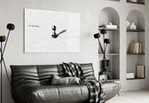 chess pawn casting a king shadow glass wall art styled above an armchair in a reading corner