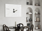 chess pawn casting a king shadow glass wall art leaning beside a dark leather sofa