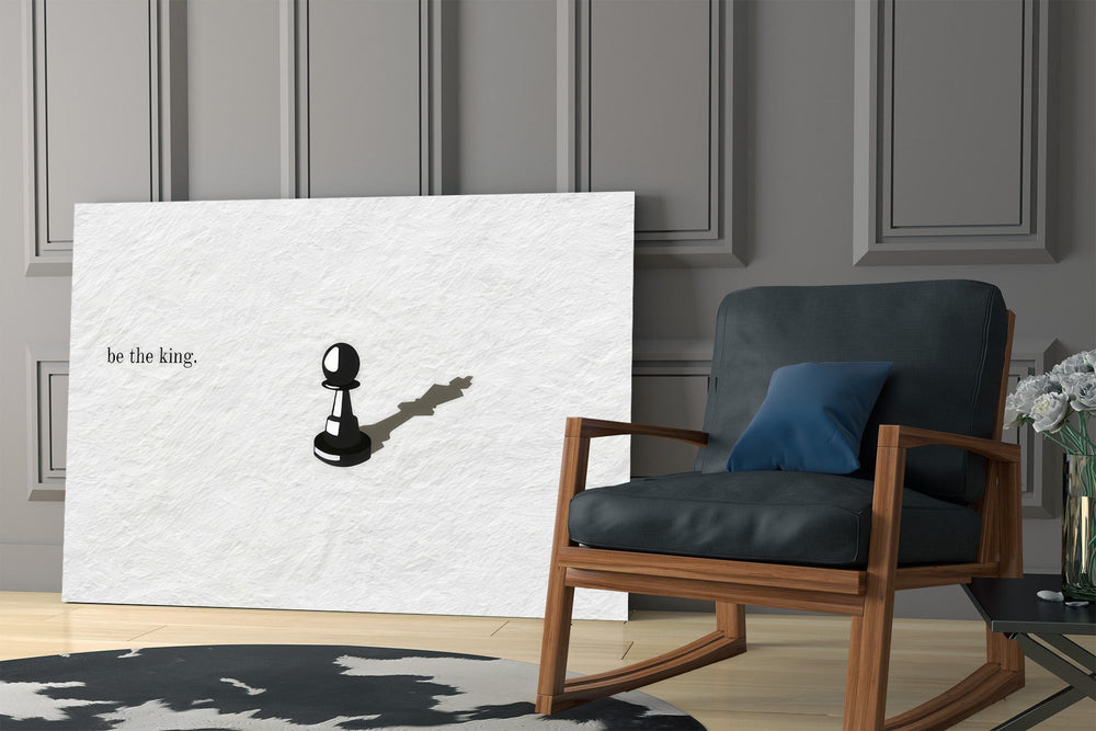 chess pawn casting a king shadow panel resting in a shelving niche in a modern interior