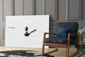 chess pawn casting a king shadow panel resting in a shelving niche in a modern interior