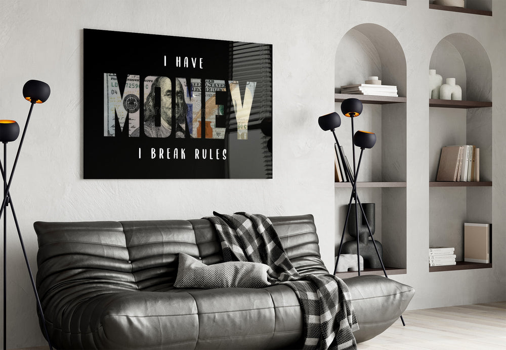 I have money I break rules dollar type glass wall art styled above an armchair in a reading corner