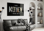 I have money I break rules dollar type glass wall art styled above an armchair in a reading corner