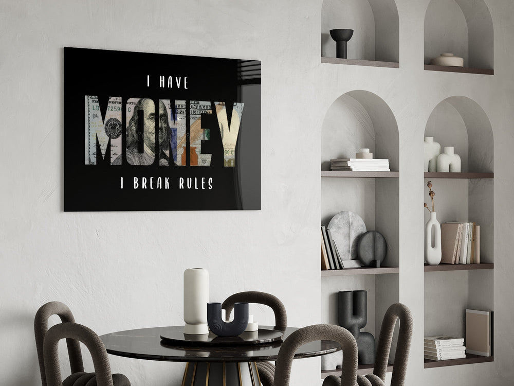 I have money I break rules dollar type glass wall art leaning beside a dark leather sofa