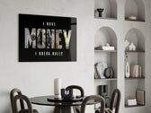 I have money I break rules dollar type glass wall art leaning beside a dark leather sofa