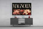 magnolia bloom typography glass wall art styled in an atmospheric room setting