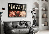 magnolia bloom typography glass wall art styled above an armchair in a reading corner