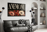 anemone bloom typography glass wall art styled above an armchair in a reading corner