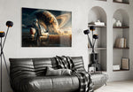 astronaut resting against a pickup truck glass wall art styled above an armchair in a reading corner