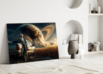 astronaut resting against a pickup truck panel bringing character to a minimalist living room wall