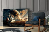 astronaut resting against a pickup truck panel resting in a shelving niche in a modern interior