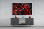black performance sedan in red smoke glass wall art styled in an atmospheric room setting