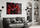 black performance sedan in red smoke glass wall art styled above an armchair in a reading corner