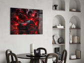 black performance sedan in red smoke glass wall art leaning beside a dark leather sofa