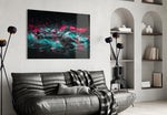 teal and pink open-wheel race car glass wall art styled above an armchair in a reading corner