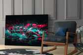 teal and pink open-wheel race car panel resting in a shelving niche in a modern interior