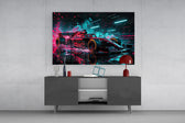 red open-wheel race car with cyan light streaks glass wall art styled in an atmospheric room setting
