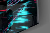 Close-up detail of the amber-rimmed tyres and cyan neon light trails on the glass surface