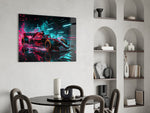 red open-wheel race car with cyan light streaks glass wall art leaning beside a dark leather sofa