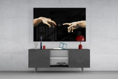two reaching hands with a loading spinner glass wall art styled in an atmospheric room setting