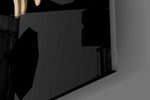 Close-up detail of the near-touching fingertips and glowing loading icon on the glass surface
