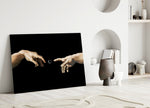 two reaching hands with a loading spinner panel bringing character to a minimalist living room wall