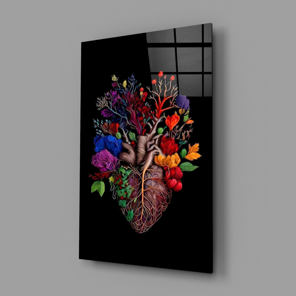 floral anatomical heart glass wall art angled to show the polished tempered glass panel
