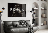focus classical marble statue glass wall art styled above an armchair in a reading corner