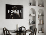 focus classical marble statue glass wall art leaning beside a dark leather sofa