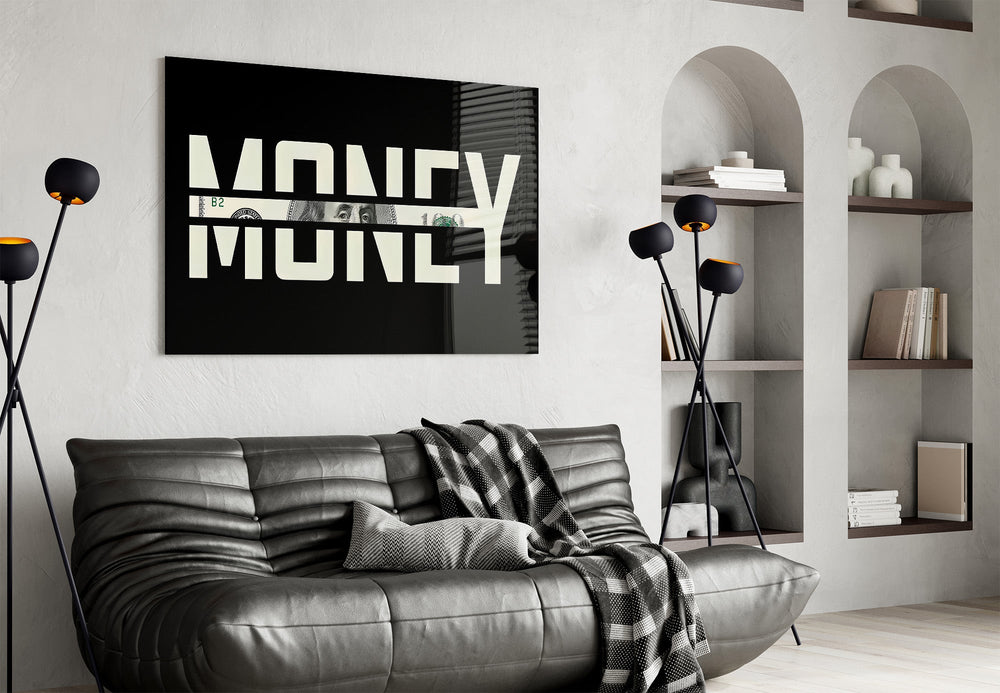 money typography with a hundred dollar bill glass wall art styled above an armchair in a reading corner