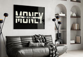 money typography with a hundred dollar bill glass wall art styled above an armchair in a reading corner